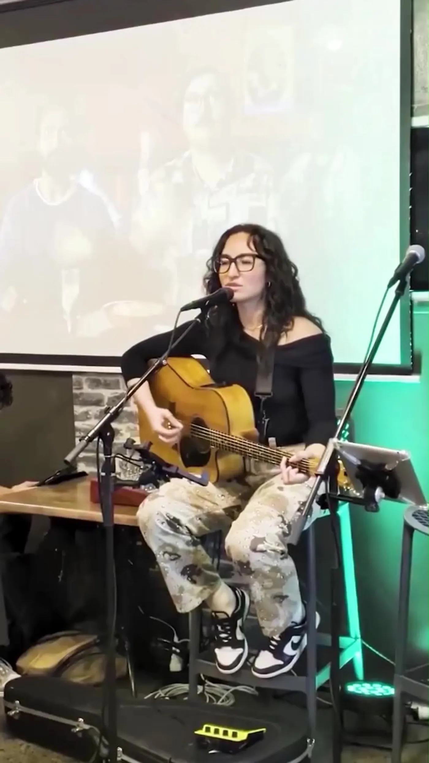 A singer with an acoustic guitar playing Friday night at Weston Bull